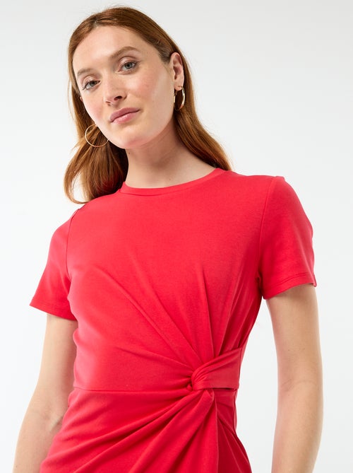 Abito t-shirt corto con fiocco fantasia - Kiabi Abito t-shirt corto con fiocco fantasia - Kiabi