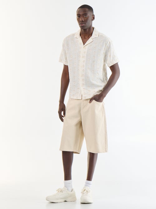 Camicia a maniche corte in maglia fantasia con ricami - Kiabi Camicia a maniche corte in maglia fantasia con ricami - Kiabi