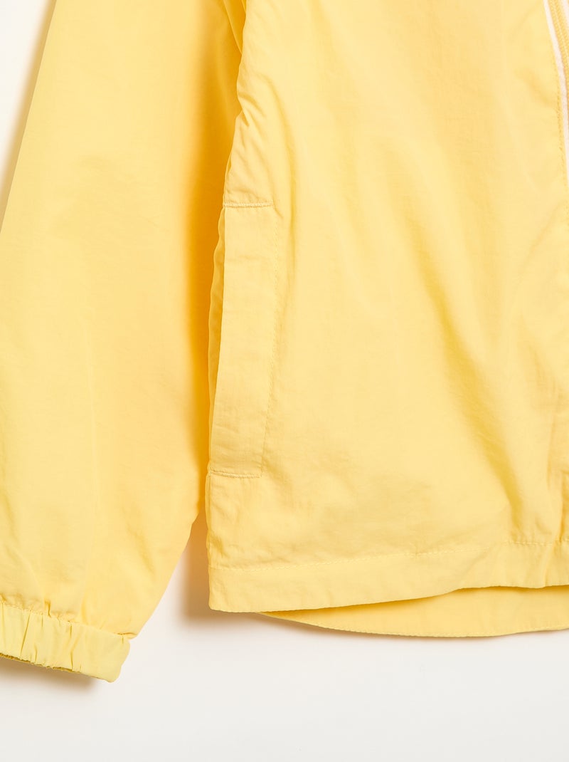Coupe-vent uni qui se range dans sa capuche Jaune - Kiabi