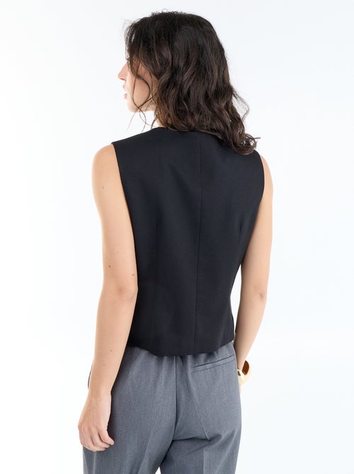 Einfarbiges ärmelloses Gilet - Kiabi Einfarbiges ärmelloses Gilet - Kiabi