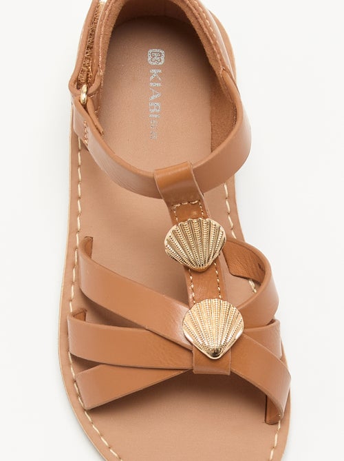 Flache Sandalen mit ausgefallenen Muschel-Schmuckdetails - Kiabi Flache Sandalen mit ausgefallenen Muschel-Schmuckdetails - Kiabi