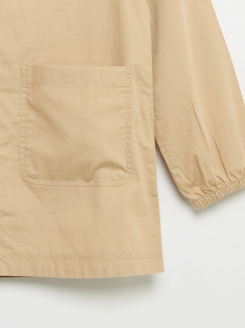 Grembiule scolastico a maniche lunghe Beige - Kiabi