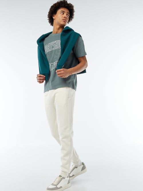 Jogging en molleton gratté avec 2 poches zippées - Kiabi