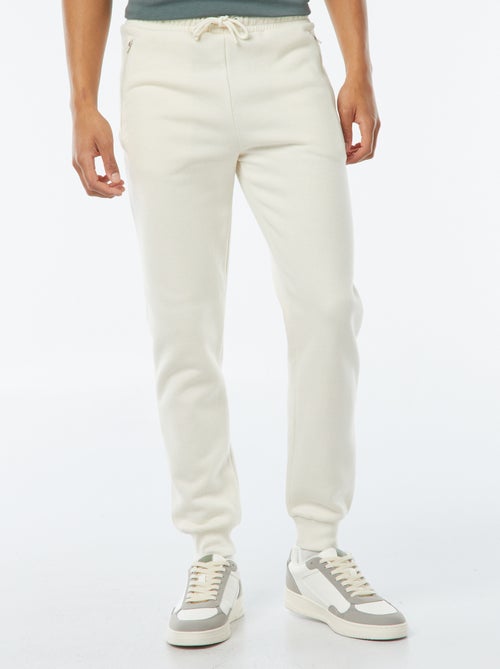 Jogging en molleton gratté avec 2 poches zippées - Kiabi