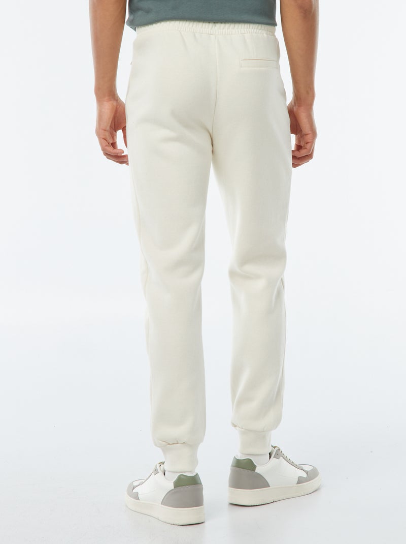 Jogging en molleton gratté avec 2 poches zippées Blanc cassé - Kiabi