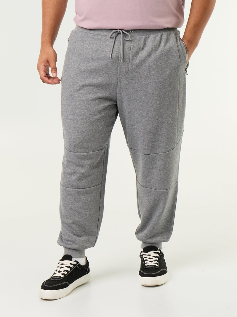 Jogginghose mit Reissverschlusstaschen und engem Beinabschluss Gris - Kiabi