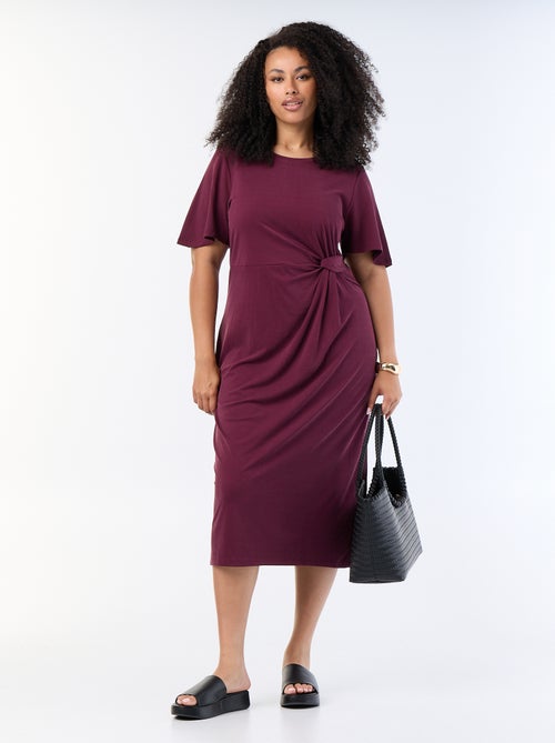 Langes, einfarbiges Kleid mit Knoten vorne - Kiabi Langes, einfarbiges Kleid mit Knoten vorne - Kiabi