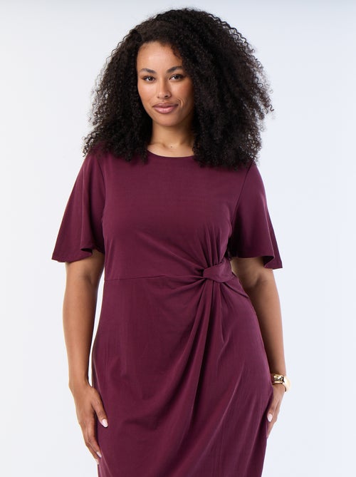 Langes, einfarbiges Kleid mit Knoten vorne - Kiabi Langes, einfarbiges Kleid mit Knoten vorne - Kiabi