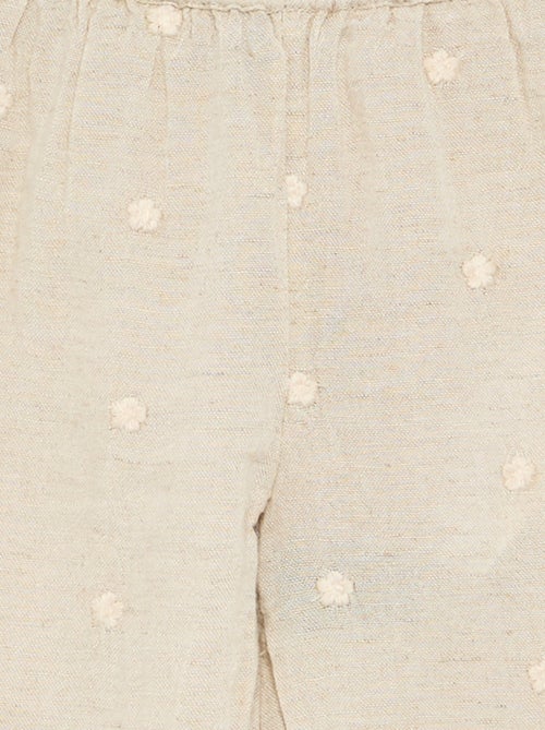Pantalon avec broderies fleurs - Kiabi