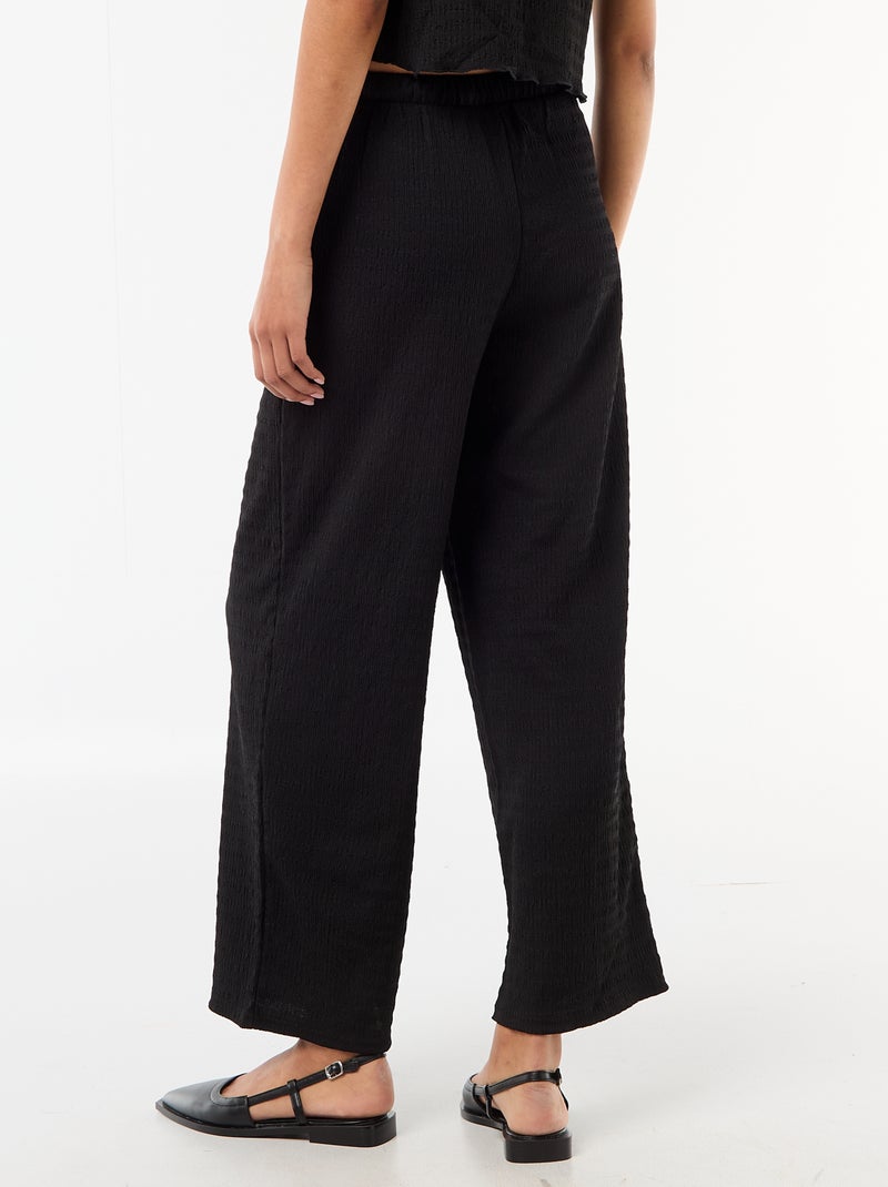 Pantalon large en maille smockée Noir - Kiabi
