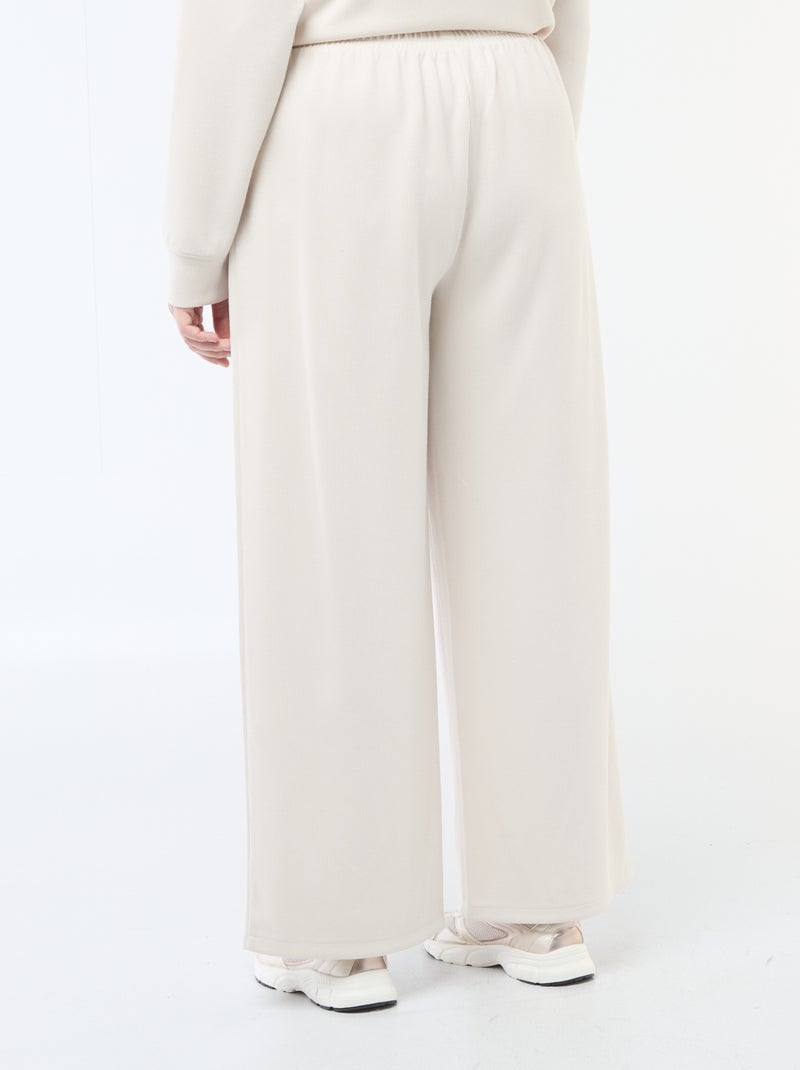 Pantalon large en matière stretch côtelée Beige - Kiabi