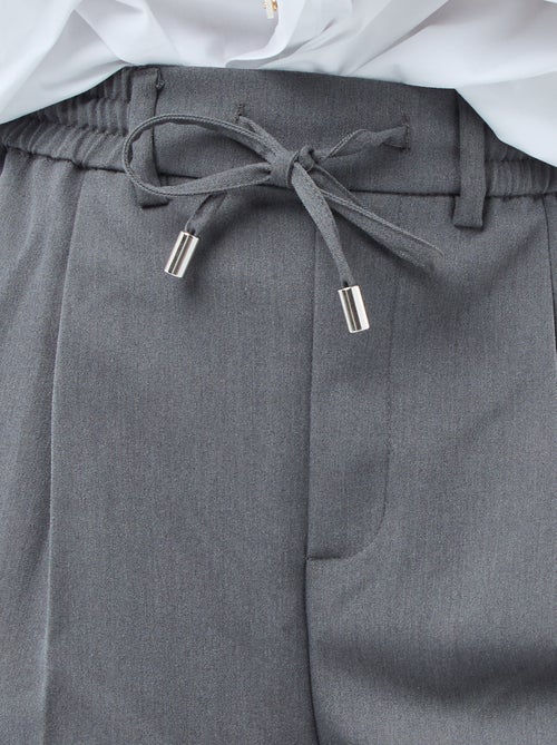 Pantaloni ampi con elastico in vita e lacci da annodare - Kiabi