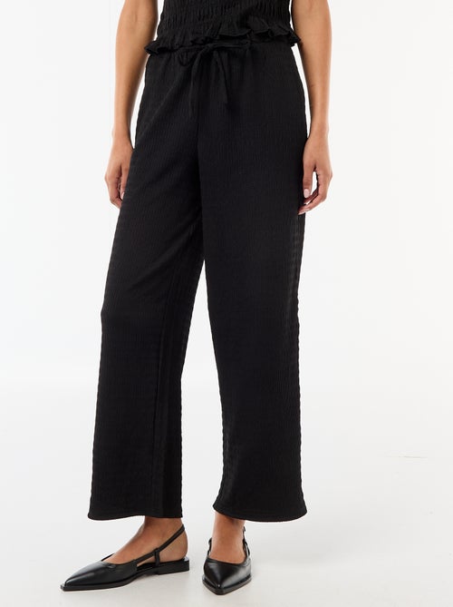 Pantaloni ampi in maglia smock - Kiabi