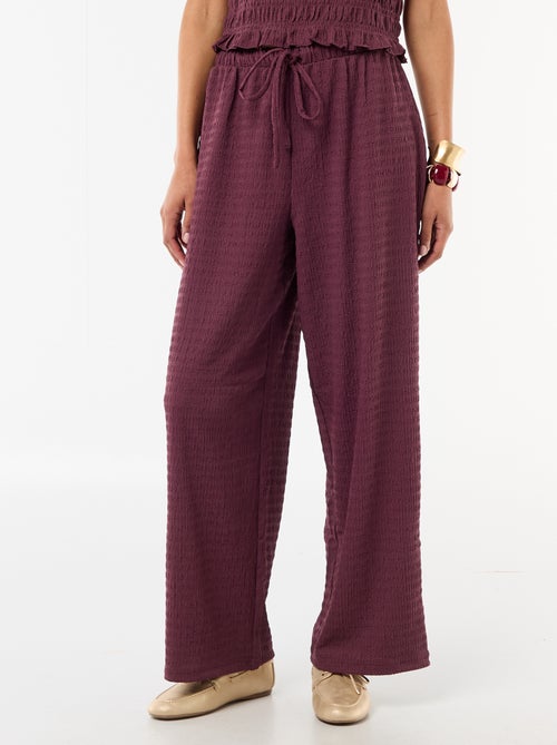 Pantaloni ampi in maglia smock - Kiabi