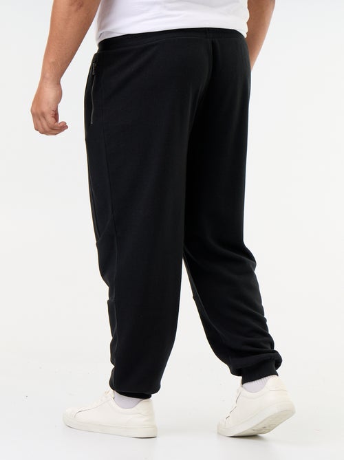 Pantaloni da jogging con fondo stretto e tasche con zip - Kiabi