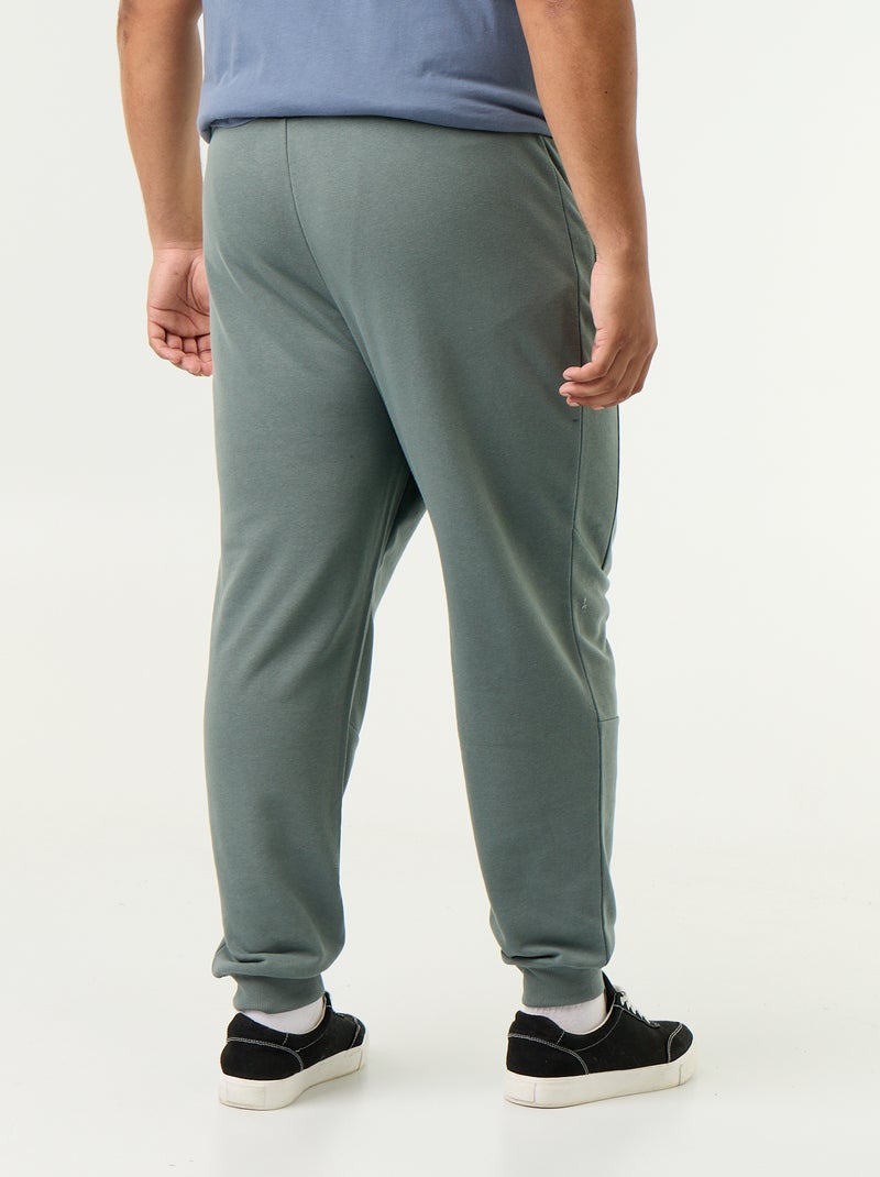 Pantaloni da jogging con fondo stretto e tasche con zip Verde - Kiabi