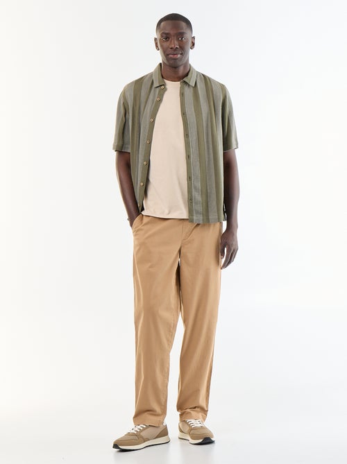 Pantaloni in tessuto effetto pelle di pesca - Kiabi Pantaloni in tessuto effetto pelle di pesca - Kiabi