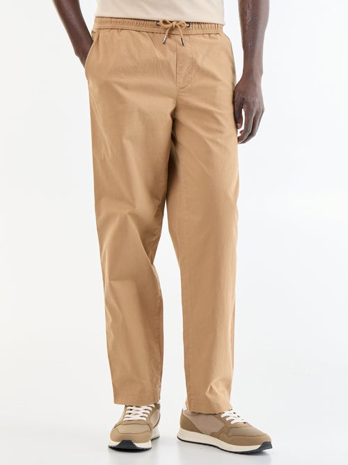 Pantaloni in tessuto effetto pelle di pesca - Kiabi Pantaloni in tessuto effetto pelle di pesca - Kiabi