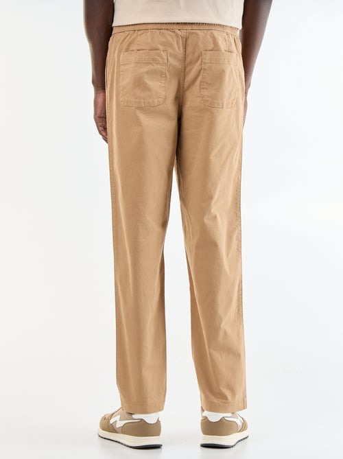 Pantaloni in tessuto effetto pelle di pesca - Kiabi Pantaloni in tessuto effetto pelle di pesca - Kiabi