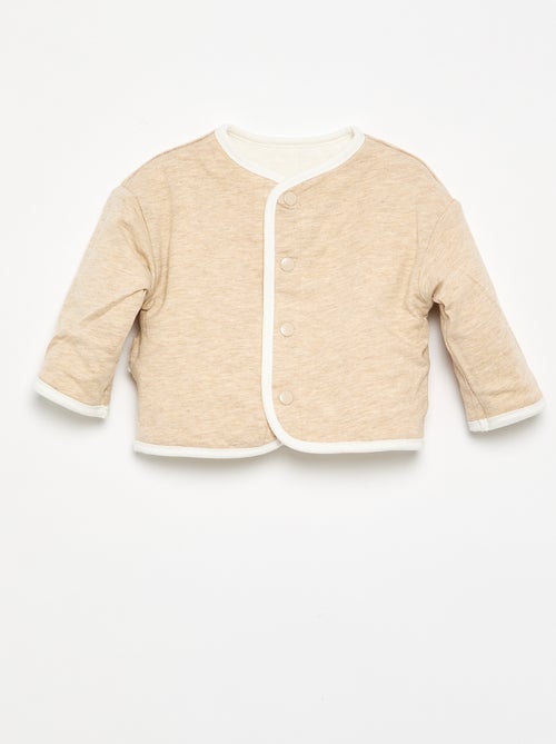 Reversible quilted snap-button jacket - Kiabi Reversible quilted snap-button jacket - Kiabi