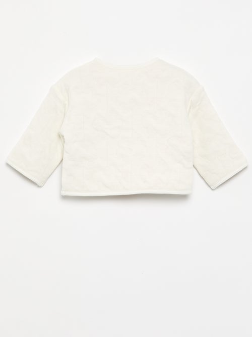 Reversible quilted snap-button jacket - Kiabi Reversible quilted snap-button jacket - Kiabi