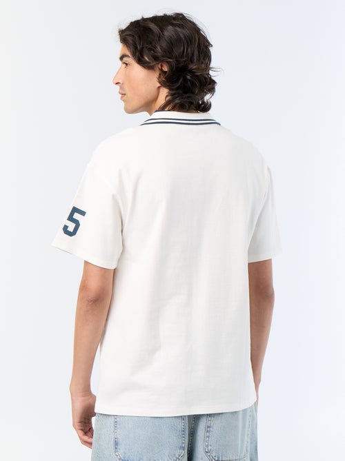 Short-sleeved polo shirt with embroidered lettering - Kiabi Short-sleeved polo shirt with embroidered lettering - Kiabi