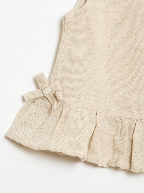 Sleeveless blouse with ruffles and bows - Kiabi