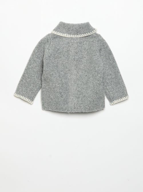 Strickjacke mit kontrastierenden Zierrändern - Kiabi Strickjacke mit kontrastierenden Zierrändern - Kiabi