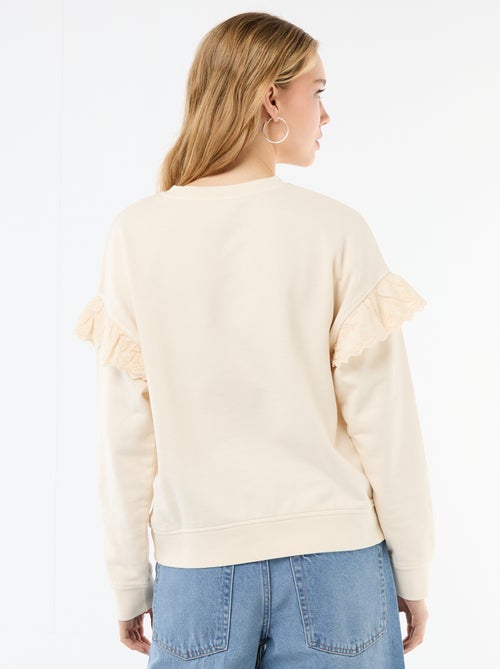 Sweat uni avec volants en borderies anglaises sur les manches - Kiabi