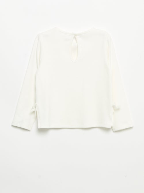 T-shirt a costine a maniche lunghe con fiocco - Kiabi T-shirt a costine a maniche lunghe con fiocco - Kiabi