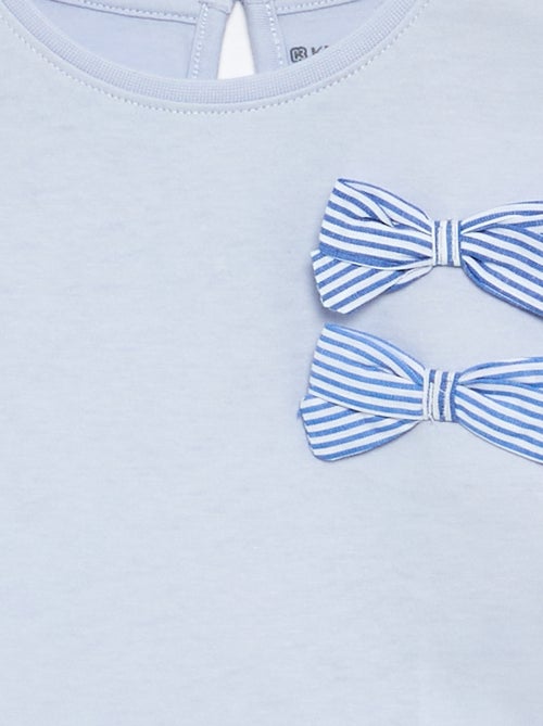 T-shirt con nodi decorativi a maniche lunghe - Kiabi T-shirt con nodi decorativi a maniche lunghe - Kiabi