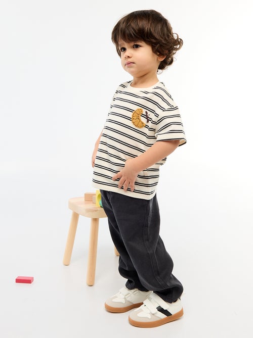 T-shirt in jersey a maniche corte con taschino stampato - Kiabi