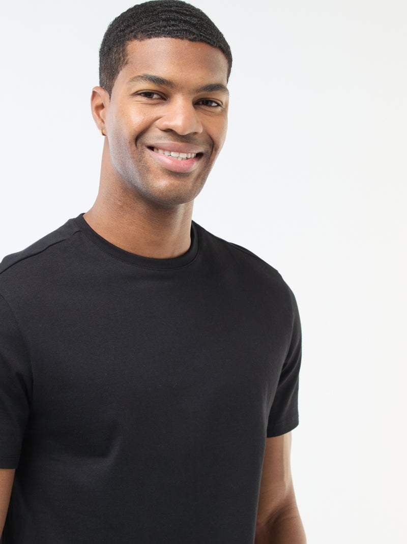 T-shirt uni en coton pour homme à col rond Noir - Kiabi