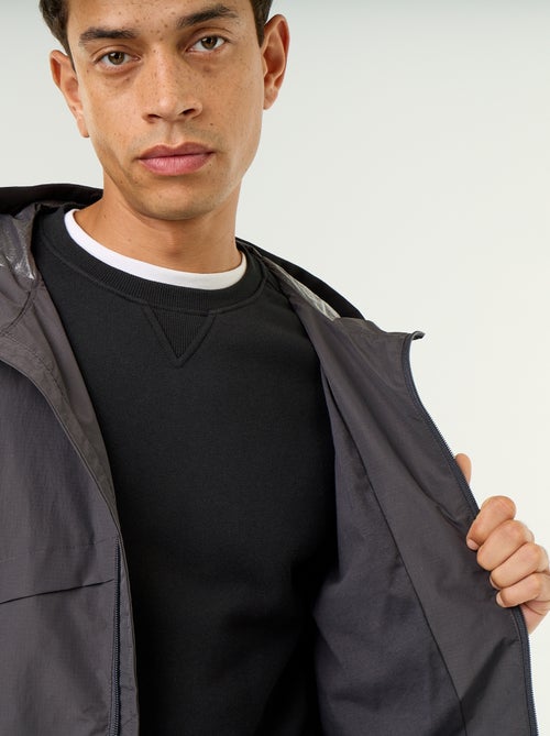 Wasserabweisende Kapuzen-Windjacke - Kiabi