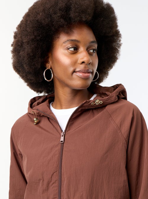 Windbreaker-Jacke mit Kapuze und Pattentaschen - Kiabi